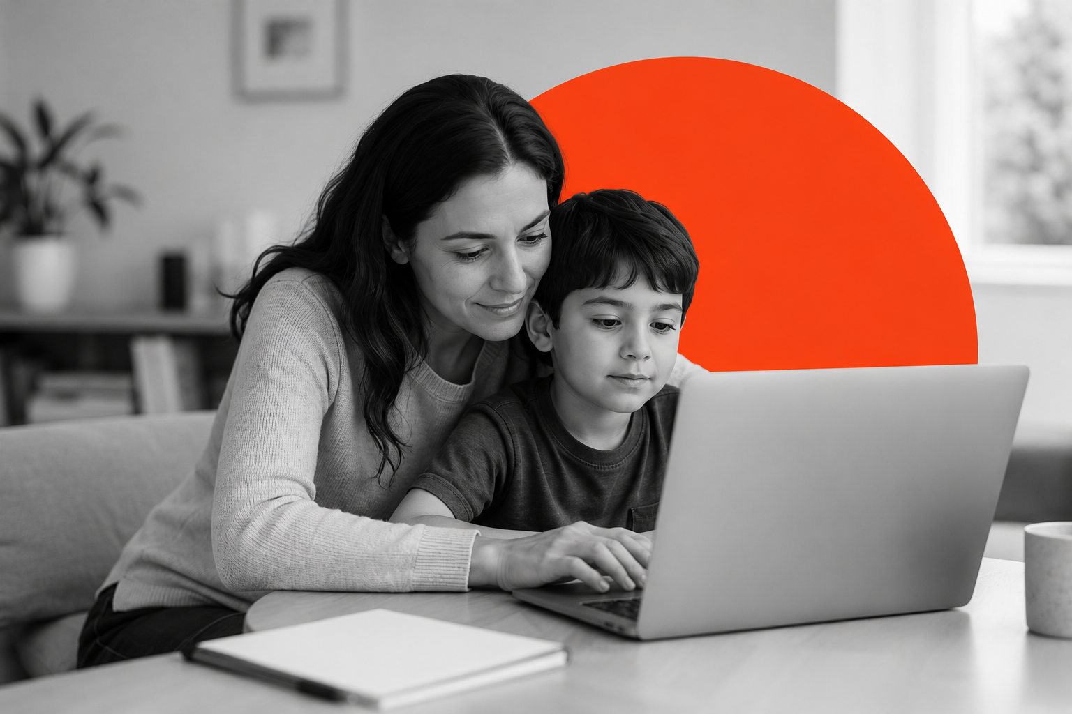 Parent and child looking at a laptop together