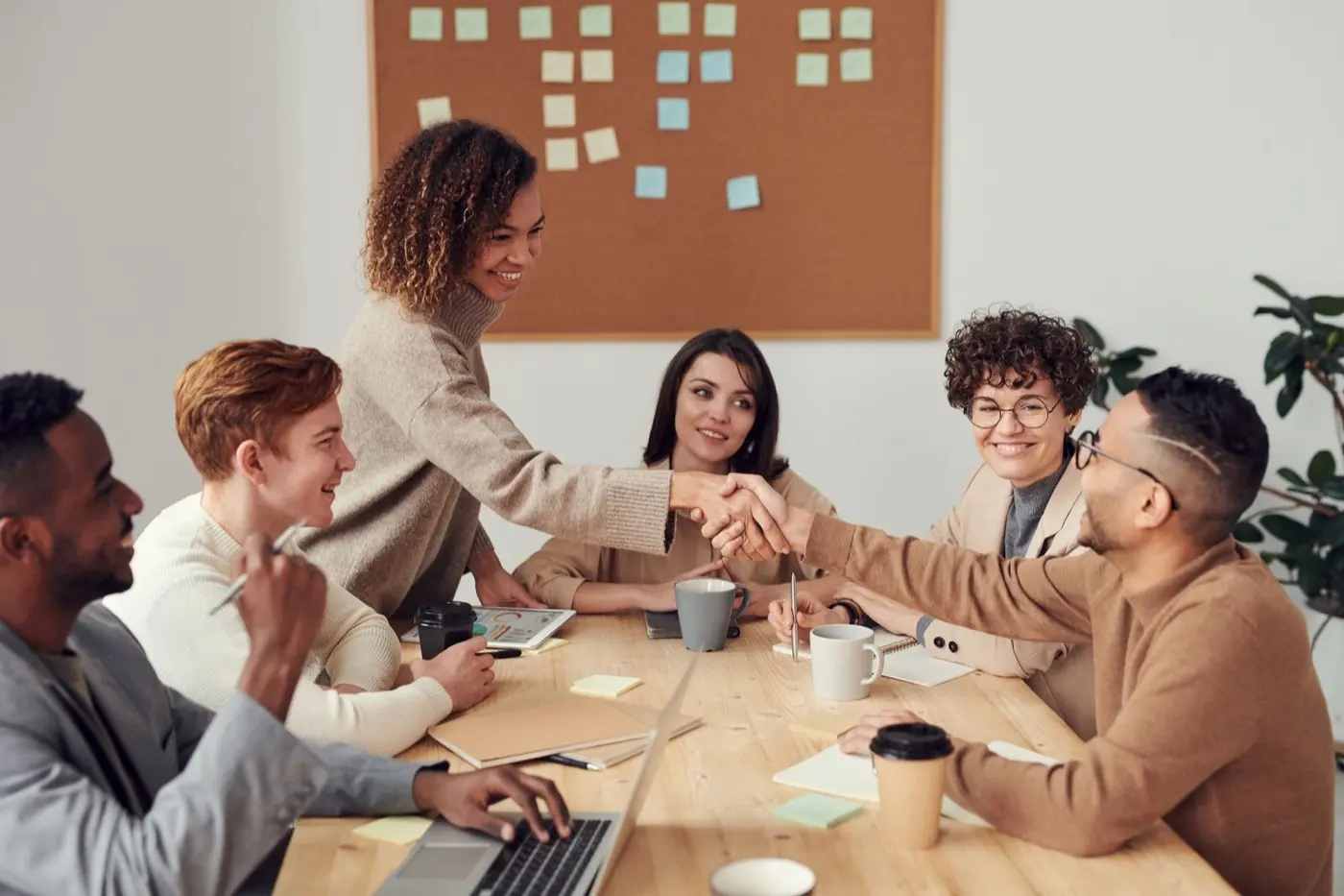 Parents and professionals meeting around a table to discuss a school plan